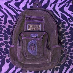 A small olive green backpack